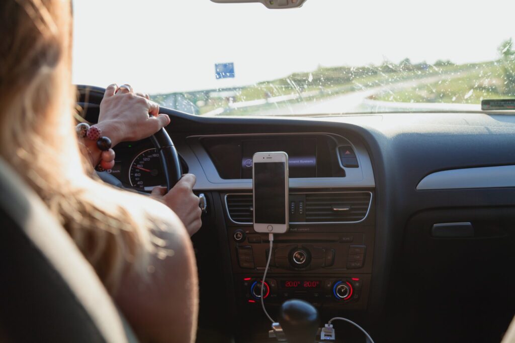 Female driving car on road trip