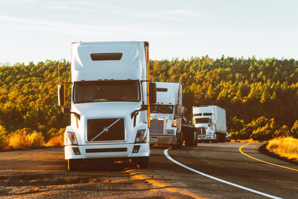 Semi Trucks driving down road